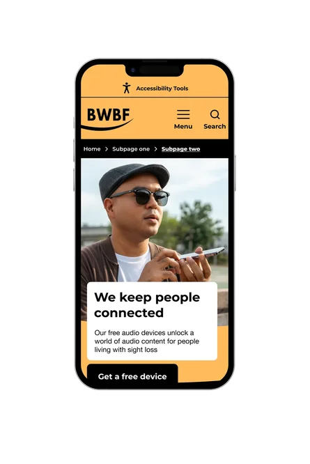 A phone showing the British Wireless for the Blind Fund subpage in their contrast colour palette, with "We keep people connected" headline, a man using an audio device, and a Get a free device button.