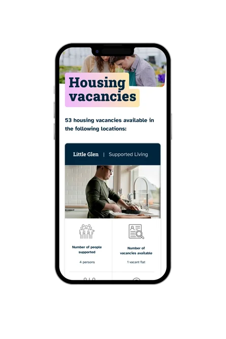 A phone showing the Affinity Trust "Housing vacancies" page, with the Little Glen supported living listing and a photo of a man cooking.