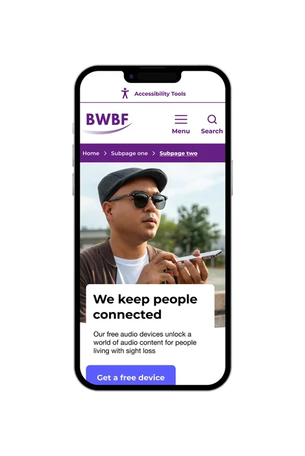 A phone showing the British Wireless for the Blind Fund subpage in their standard colour palette, with "We keep people connected" headline, a man using an audio device, and a Get a free device button.