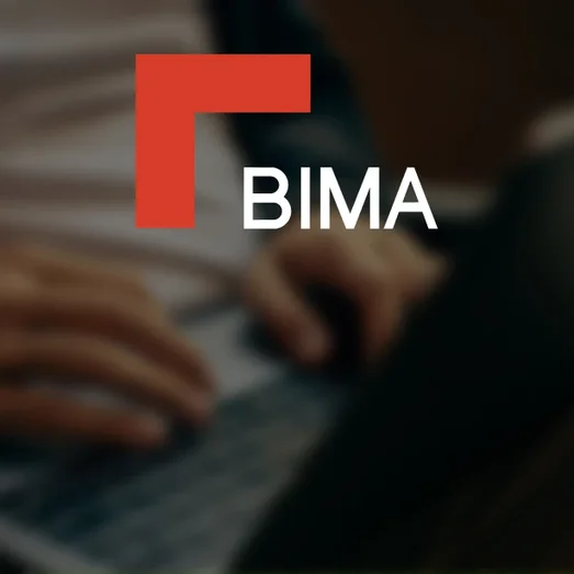 BIMA logo over a blurred photo of someone typing on a laptop.