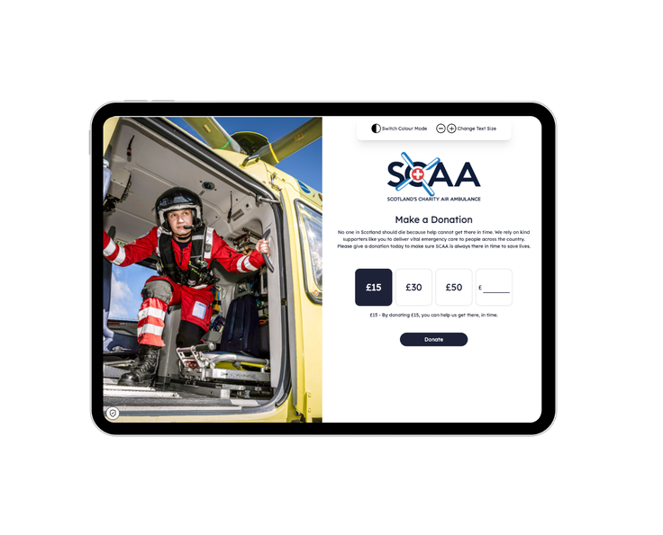 The first page of the donation journey for Scotland's Charity Air Ambulance, showing a paramedic crouching in the open door of their yellow helicopter, and the 'Make a Donation' options beside, including pre set donation amounts.