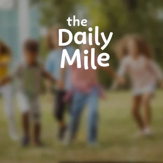 The Daily Mile logo over a blurred photo of children running outdoors.