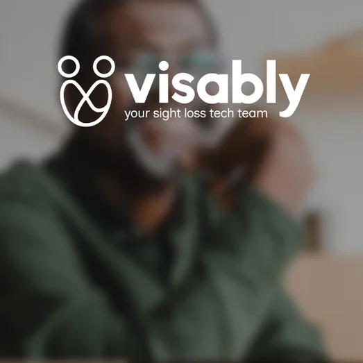 Visably logo ("your sight loss tech team") over a blurred photo of a man wearing glasses.