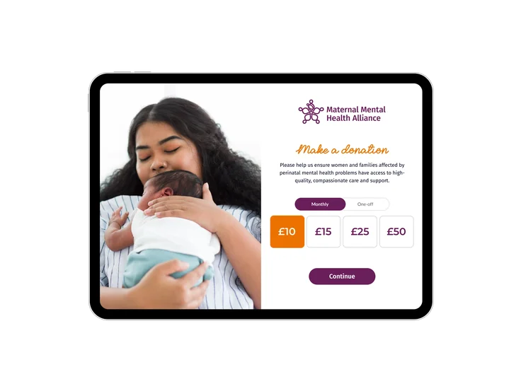 A tablet showing the Maternal Mental Health Alliance donation page, with donation amount options and a photo of a mother holding her baby.
