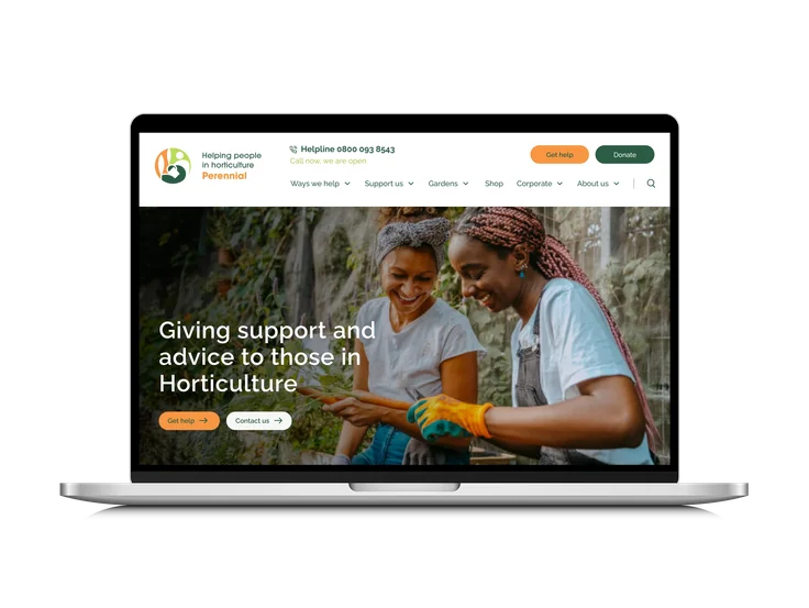 A laptop showing the Perennial homepage, with "Giving support and advice to those in Horticulture" headline over a photo of two people gardening.