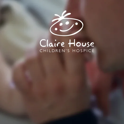 Claire House Children's Hospice logo over a photo of an adult holding a child's hand.